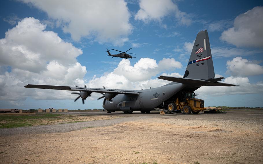 Members of the 75th Expeditionary Airlift Squadron transfer cargo aboard a C-130J Super Hercules from Camp Lemonnier, Djibouti, to Manda Bay, Kenya, on May. 7, 2021.