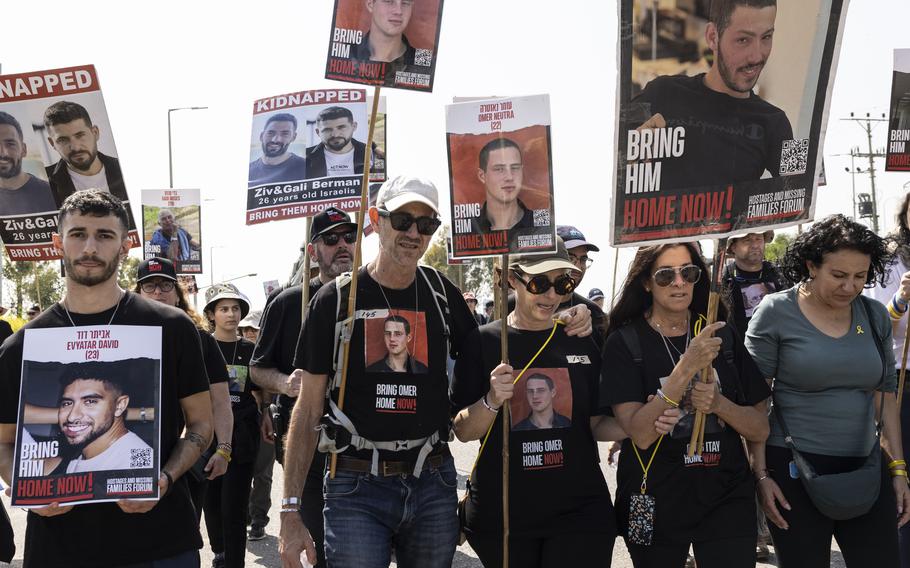 Ronen and Orna Neutra, center, the parents of Israeli American hostage Omer Neutra, along with other family members of the hostages held by Hamas, take part in a demonstration Wednesday, Feb. 28, 2024, near the Israeli border with Gaza.