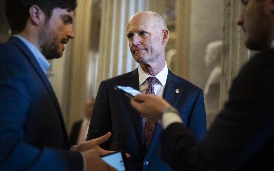 Sen. Rick Scott, R-Fla., center, head of the effort to elect Republican senators, speaks with reporters on Capitol Hill on June 22, 2021, in Washington, D.C. 