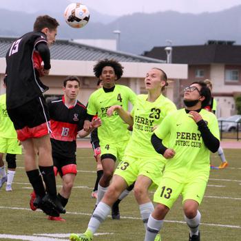 E.J. King's Kai Sperl heads the ball in front of Matthew C. Perry's Shion Fleming, Joshua Norris and Nathanry Mercado during Friday's DODEA-Japan soccer match. The Samurai won 3-1.