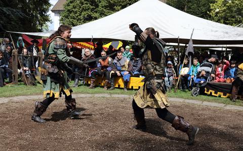 Medieval reenactors swordfight 