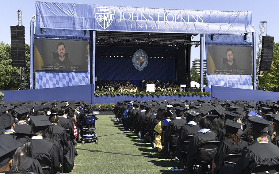 Ukrainian President Volodymyr Zelenskyy addresses the graduating class of Johns Hopkins University via livestream from Ukraine, Thursday, May 25, 2023, in Baltimore, Md.