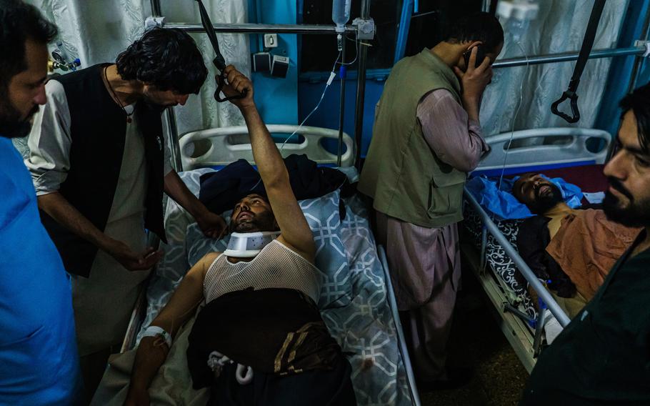 Family members visit wounded patients who have been admitted into Wazir Akbar Khan Hospital in Kabul, Afghanistan, on Thursday, Aug. 26, 2021, following explosions at the airport in Kabul.