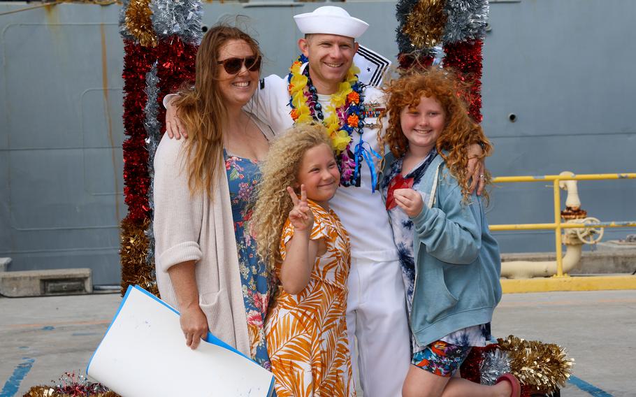 A sailor assigned to the Ticonderoga-class guided missile-cruiser USS Antietam (CG 54) reunites with family after arriving at new homeport Joint Base Pearl Harbor-Hickam, Hawaii, Friday, April 5, 2024. 