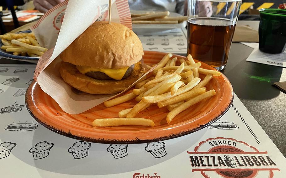 The cheeseburger and fries at Mezza Libbra Burger and Bakery in Pordenone, Italy, on Feb. 2, 2024. The burger is a quarter-pound patty served on a toasted bun with cheese. 