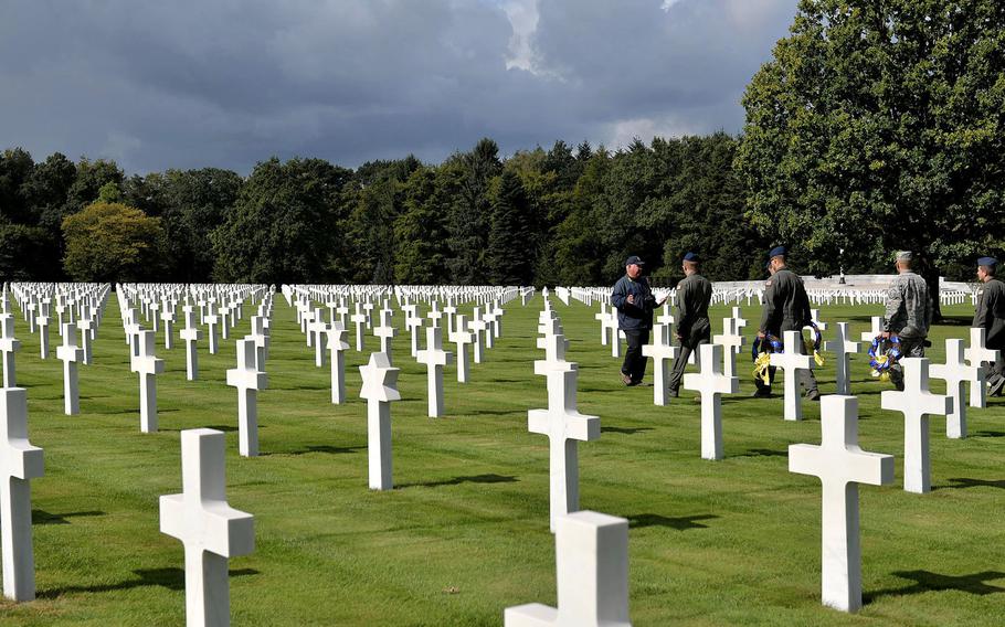 U.S Air Force members from Little Rock Air Force Base, Ark., on the grounds at Ardennes American Military Cemetery in Belgium before a wreath-laying ceremony in 2017. 