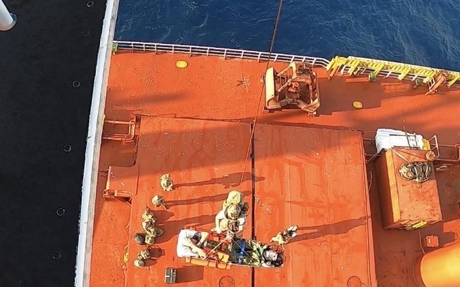 U.S. Air Force pararescuemen assigned to Combined Joint Task Force - Horn of Africa Personnel Recovery Task Force hoist U.K. merchant mariner Kevin Nixon on board a Super Puma helicopter during a complex, two-day medical evacuation from the Indian Ocean.  