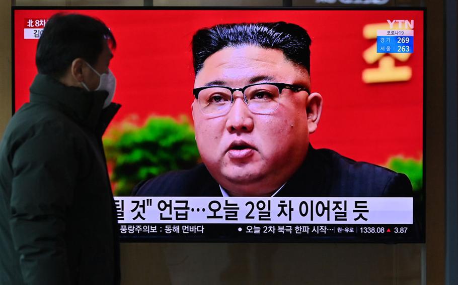 A man watches a television screen showing news footage of North Korean leader Kim Jong Un attending the 8th congress of the ruling Workers' Party held in Pyongyang, at a railway station in Seoul on Jan. 6, 2021. 