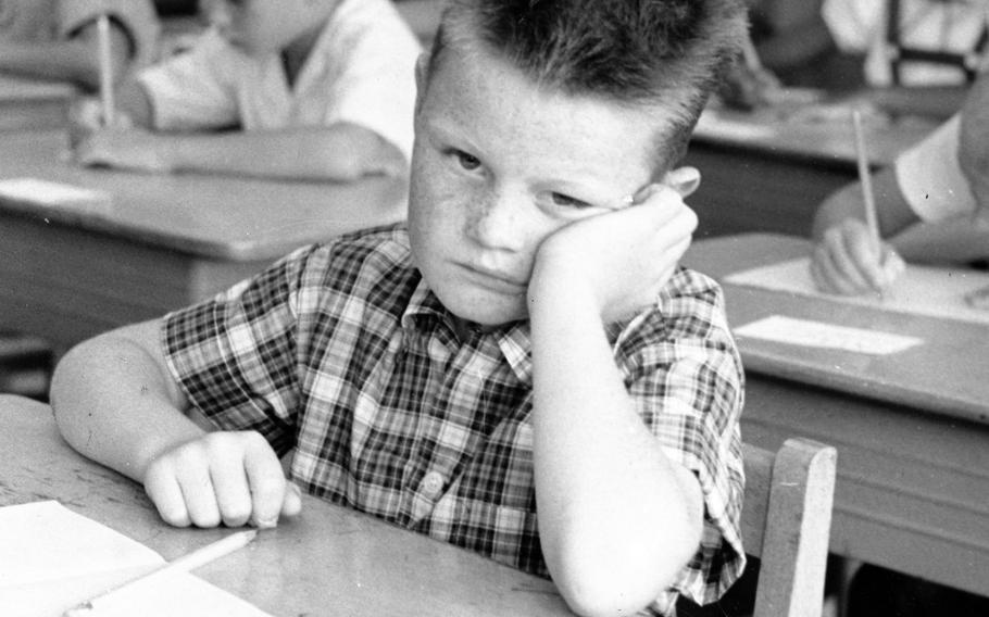 The sad expression on the face of 8-year-old Danis Taylor proves that summer vacation is over on the first day of school at Tachikawa Elementary School on Sept. 2, 1958.