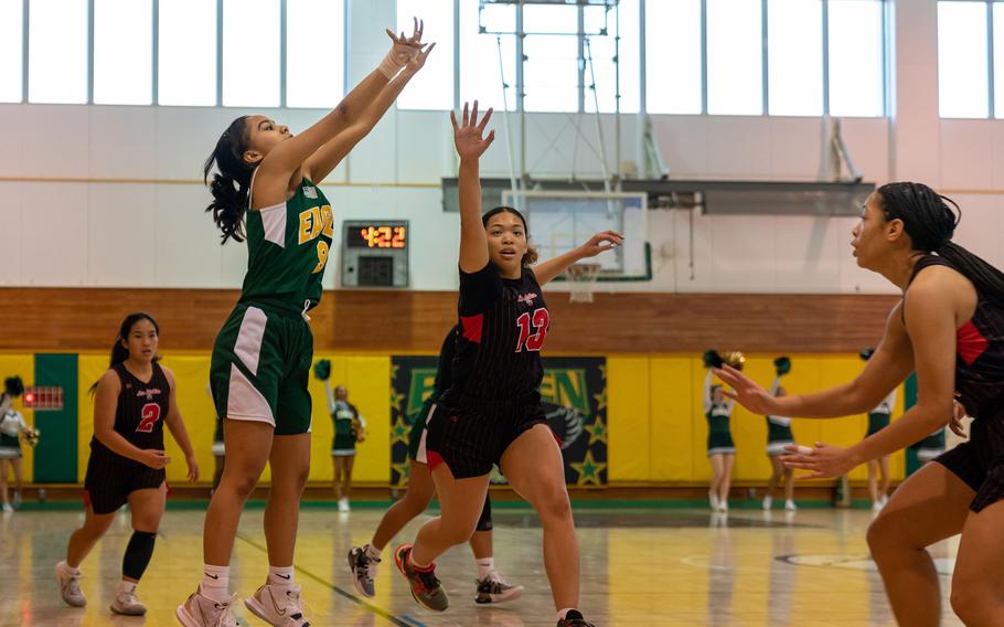 Robert D. Edgren's Maliyah Magat launches a three-pointer against Nile C. Kinnick during Saturday's DODEA-Japan girls basketball game. The Red Devils won 42-9 to sweep the two-game weekend series.