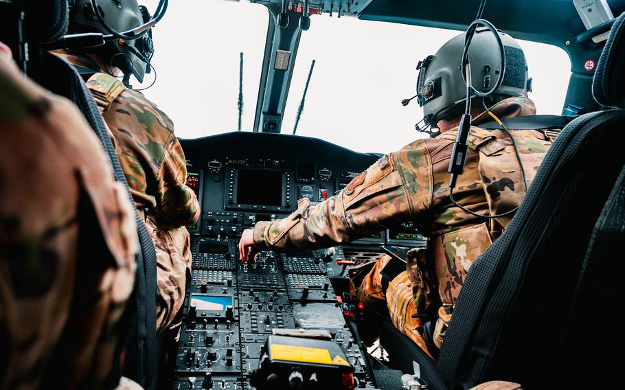 Airmen conduct pre-flight procedures in a 550 HS MH-139 Grey Wolf.