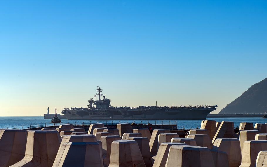 The aircraft carrier USS Carl Vinson arrives at Busan, South Korea, Tuesday, Nov. 21, 2023.