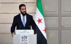 Syrian President Ahmed al-Sharaa speaks during a joint press conference with French President after a meeting at the Elysee Palace in Paris, on May 7, 2025. Syrian interim President Ahmed al-Sharaa arrived in Paris on May 7, state media reported, on his first visit to Europe since overthrowing longtime ruler Bashar al-Assad in December. (Stephanie Lecocq/POOL/AFP via Getty Images/TNS)