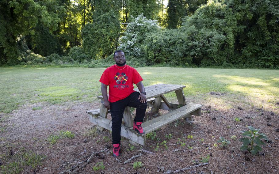 Derek Boone, 34, sits near the Isle of Wight County Courthouse, where he pushed for a Confederate monument to be removed. 