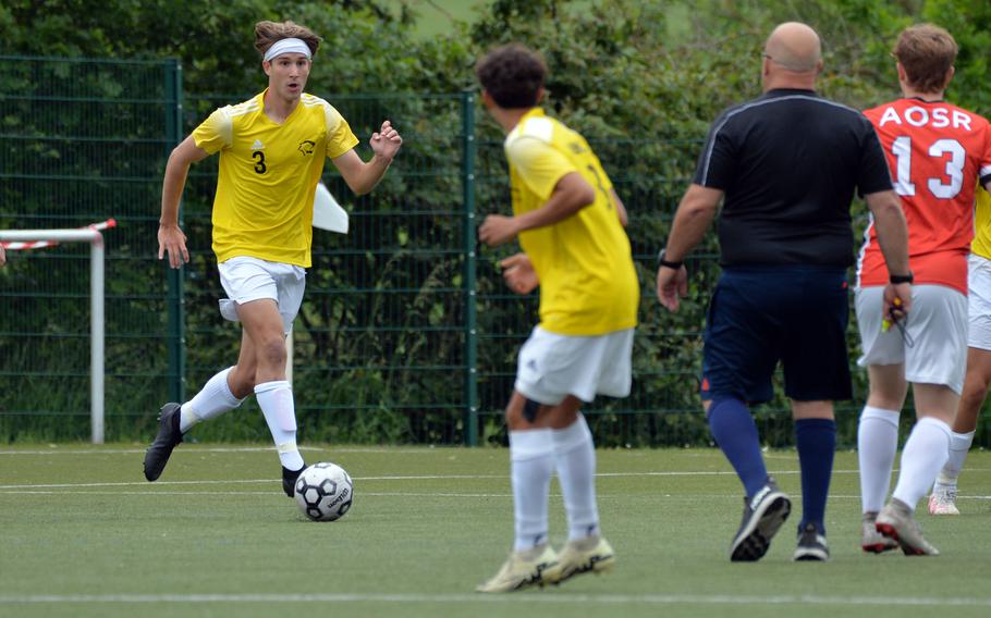 Vicenza’s Andrew McGovern looks for a teammate to pass to in the Cougars’ 3-1 loss against AOSR in a Division II game at the DODEA-Europe soccer finals at Reichenbach-Steegen, Germany, May 21, 2024.