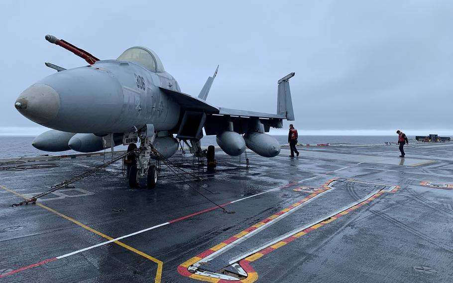An F/A-18 Super Hornet jet sits on the flight deck of the USS Gerald R. Ford, Navy’s newest aircraft carrier, in international waters off the Atlantic coast of France on Nov. 13, 2022. 