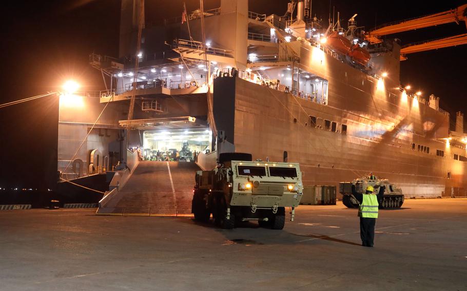 Vehicles assigned to the 402nd Army Field Support Brigade are loaded onto the USNS Red Cloud at Subic Bay, Philippines, April 11, 2022. 