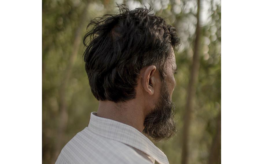 A father of five poses for a portrait in Cox’s Bazar, Bangladesh. He left on a boat to Myanmar where he was arrested and detained. He still wants to find a way to leave the camps. 