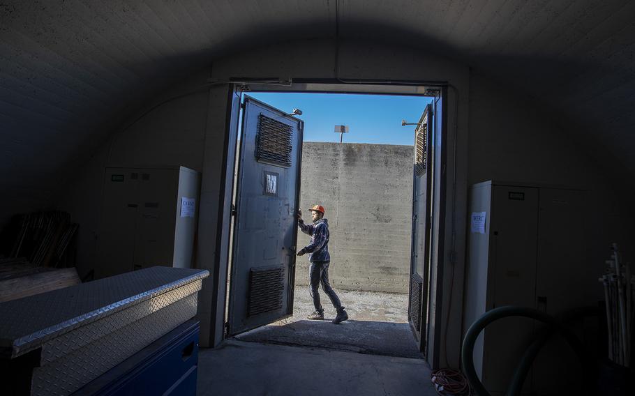 U.S. Geological Survey biologist Jared Heath opens the massive steel doors of a former WWII munitions bunker at the decommissioned El Toro Marine Corps Air Station on Wednesday, Dec. 14, 2022, in Irvine, Calif. The bunker is used to store an important collection of invertebrates.