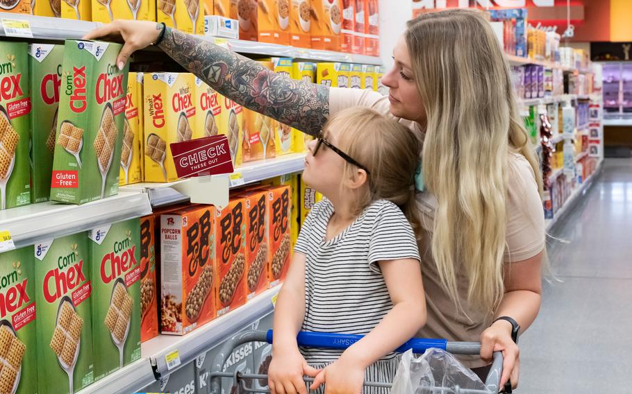 Meghan Giguere, a Kaiserslautern Military Community resident whose husband is in the Air Force, shops for groceries with her daughter at Ramstein Air Base on May 23, 2022. 