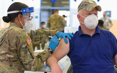 Joe Gallagher, a U.S. Army veteran, receives a COVID-19 vaccination at the 7th Army Training Command's (7ATC) Rose Barracks, Vilseck, Germany, May 3, 2021. The U.S. Army Health Clinics at Grafenwoehr and Vilseck conducted a "One Community" COVID-19 vaccine drive May 3-7 to provide thousands of

appointments to the 7ATC community of Soldiers, spouses, Department of the Army civilians, veterans and local nationals employed by the U.S. Army. 

(U.S. Army photo by Markus Rauchenberger)