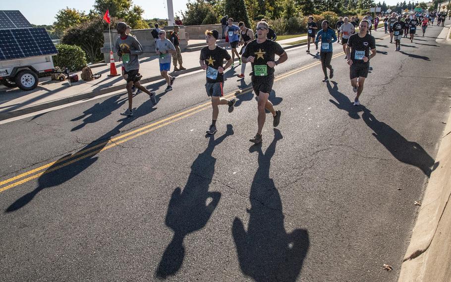 Runners approach the finish line of the Army 10-Miler on Sunday, Oct. 9, 2022, at the Pentagon.