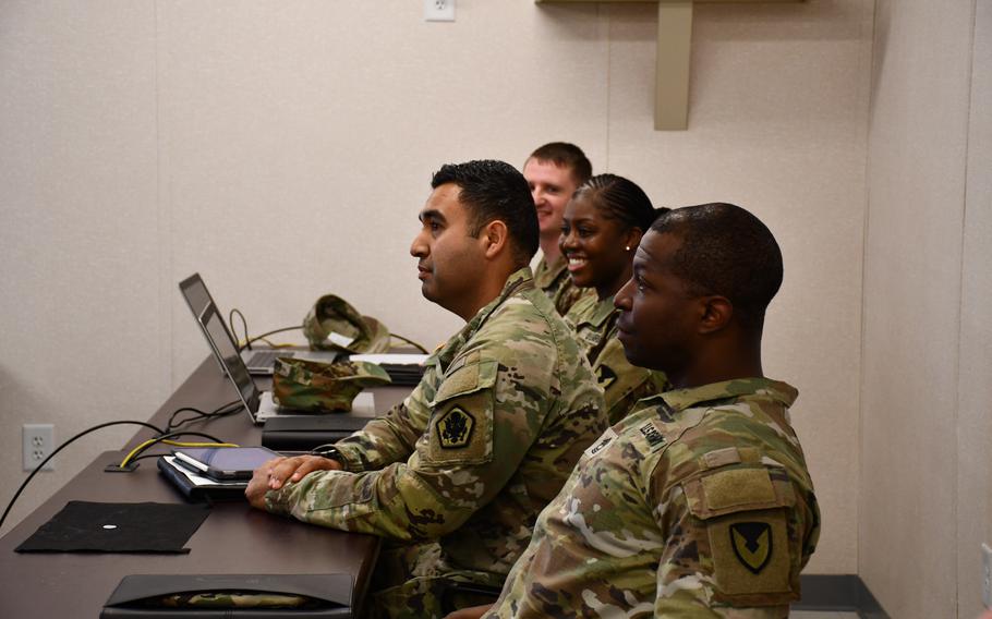 Command Sgt. Maj. Tawonda Sanders, Sgt. 1st Class Edward Gonzalez, 1st Sgt. Michael King and Master Sgt. Corey Perriman learned about each phase of the Transition Assistance Program by walking through five stations and listening to briefs from several counselors during a TAP open house at Joint Base Myer-Henderson Hall, Va., in March 2022.