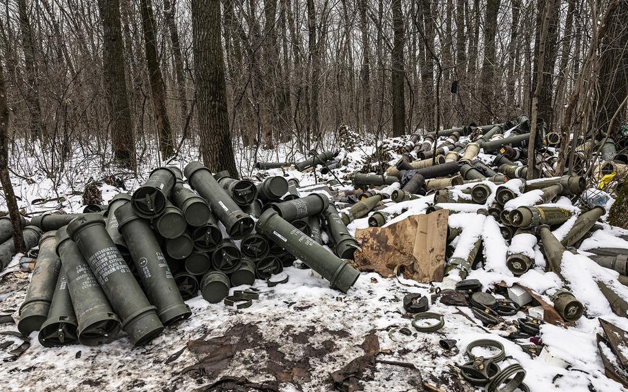 A cache of ready 155mm howitzer shells in the forest near Vuhledar on Thursday, Feb. 2, 2023.