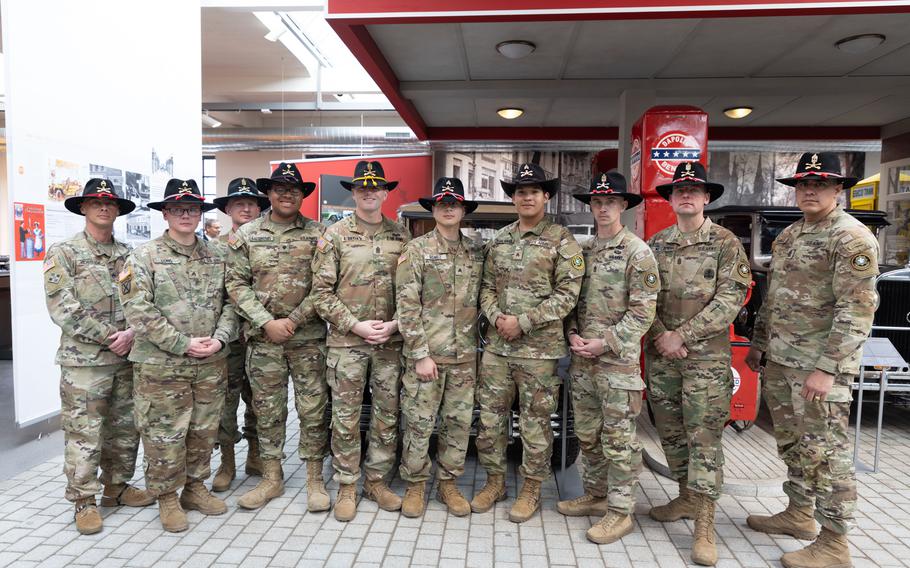 U.S. Soldiers assigned to the 2nd Cavalry Regiment stand for a group photo at the August Horch Museum in Zwickau, Germany, March 27, 2024, following a guided tour of the museum and a recognition ceremony at the Zwickau Police headquarters. The soldiers were recognized by the Zwickau Police Department for aiding four injured local citizens following a traffic incident in May of 2023.