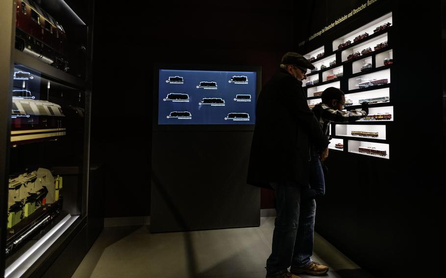 Visitors view the model trains at the Deutsche Bahn Museum in Nuremberg, Germany, on Dec. 20, 2023. The museum's collection boasts over 2,000 trains from various time periods.