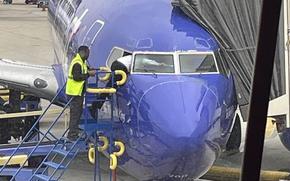 A Southwest Airlines pilot had to scramble through a cockpit window into a jet after a door accidentally locked on a Sacramento-bound plane.