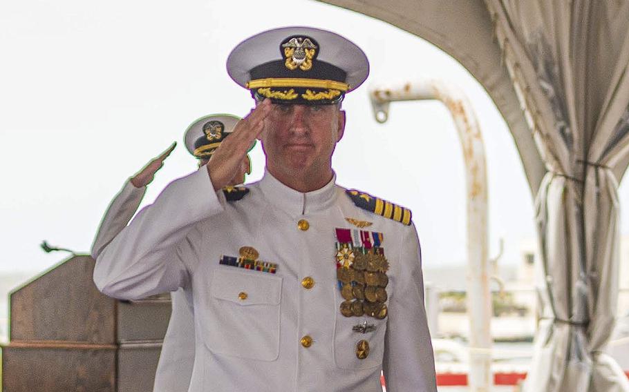 Capt. Mark Sohaney, Commander, Joint Base Pearl Harbor-Hickam salutes during a ceremony on June 14, 2022, aboard USS Missouri (BB-63). Sohaney says the Navy is working with the Hawaii’s Department of Health to address concerns about water quality.