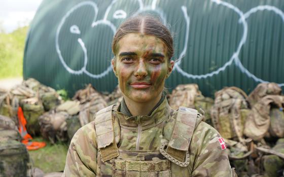 CORRECTS THE NAME OF PERSON'S ROLE - 21-year-old Anne Sofie poses for a photo during final exercises at a training area close to Royal Danish Army’s barracks in Hovelte, 25 kilometres north of Copenhagen, Denmark, Wednesday, June 11, 2025. (AP Photo/James Brooks)