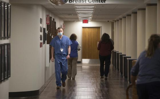 Staff at The University of Kansas Health System St. Francis campus are seen on the first level of the hospital on Nov. 29, 2022, in Topeka, Kan. The University of Kansas Health System-St. Francis Campus in Topeka is on “divert status” because of a Nov. 23, 2023, cyber attack. Debbie Cluck, a spokeswoman, said it affects ambulance and that the emergency room is open. The disruption is sending patients flooding into the city's other hospital. (Evert Nelson/The Topeka Capital-Journal via AP)
