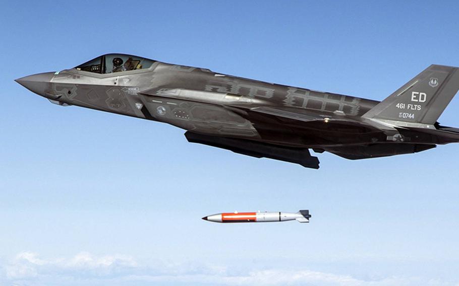 A bomb drops from an in-flight f-35.