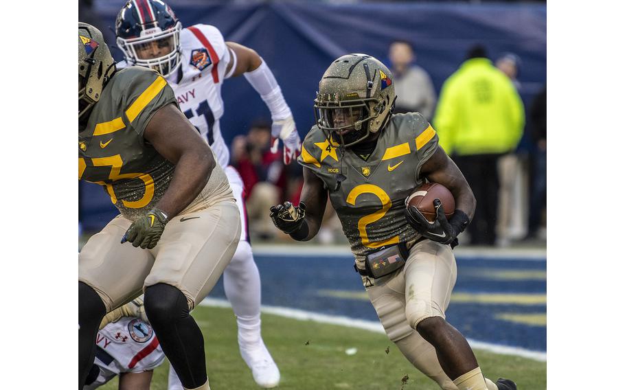 Army quarterback Tyhier Tyler tries to find a hole to run through deep in Army territory during first quarter play in the annual Army-Navy matchup in Philadelphia on Saturday, Dec. 10, 2022, 