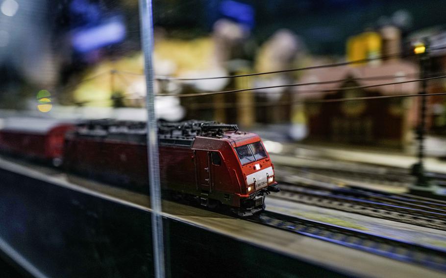 A model train zips through a miniature landscape at the Deutsche Bahn Museum in Nuremberg, Germany, on Dec. 20, 2023. A small camera inside the train allows visitors to immerse themselves in the exhibit.