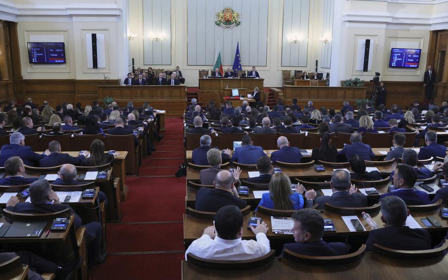 Interior view of the Bulgarian Parliament during a meeting, in Sofia, Bulgaria, Wednesday, Dec. 14, 2022. A European Union commissioner from Bulgaria has been nominated for the post of prime minister as the Balkan country struggles to end a two-year period of political instability and economic hardship. Maria Gabriel was tipped on Wednesday by the center-right GERB party to receive a mandate. 