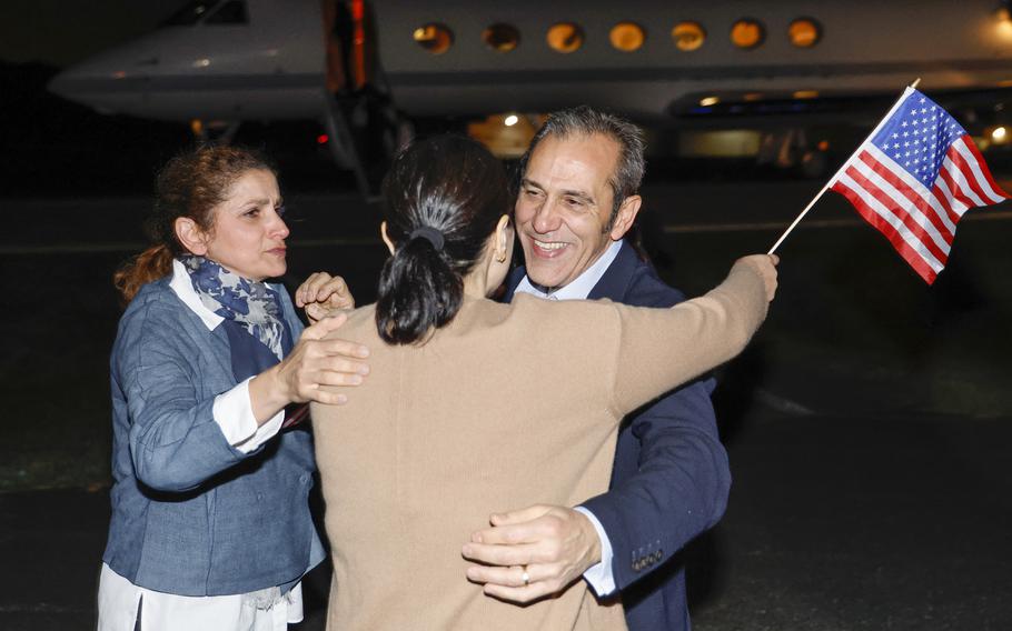 Family members embrace freed American Emad Shargi after he and four fellow detainees were released in a prisoner swap deal between U.S and Iran, as he arrives at Davison Army Airfield, Tuesday, Sept. 19, 2023, at Fort Belvoir, Va. 