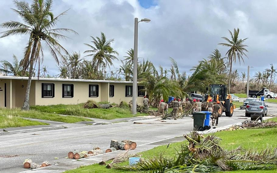 Airmen with the 554th Red Horse Squadron clear storm debris from a housing area at Andersen Air Force Base, Guam, Friday, June 2, 2023.