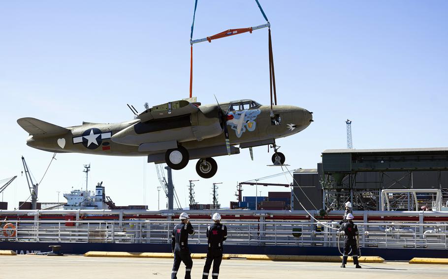 The Douglas A-20 Havoc bomber Hell’N Pelican II is loaded onto the ADV Reliant.