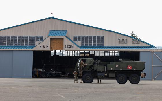 U.S. Marines unload an M142 High Mobility Artillery Rocket System from a C-130 Hercules at Naval Air Facility Atsugi, Kanagawa, Japan, June 6, 2025. The training demonstrates 3d Battalion, 12th Marine’s ability to rapidly deploy long-range fire throughout the Indo-Pacific. A HIRAIN is the process of identifying a target, seizing key terrain, inserting HIMARS, destroying the target and retrograding back to a secure location. The Marines are with 3/12, 3d Marine Division and Marine Aerial Refueler Transport Squadron (VMGR) 152, Marine Aircraft Group 12, 1st Marine Aircraft Wing. (U.S. Marine Corps photo by Lance Cpl. Rodney Frye)