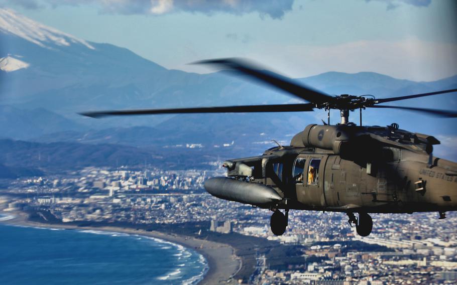 A U.S. Army Black Hawk helicopter takes part in First Flight 2022 over Tokyo, Tokyo Bay and Chiba prefecture along with aircraft of the Japan Ground Self-Defense Force on Jan. 18, 2022.