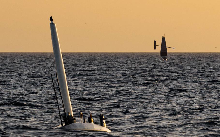 An Ocean Aero Triton unmanned surface vessel (left) operates in the Arabian Gulf with a Saildrone Explorer USV during a bilateral exercise between the U.S. Navy and United Arab Emirates navy, Feb. 16, 2023.