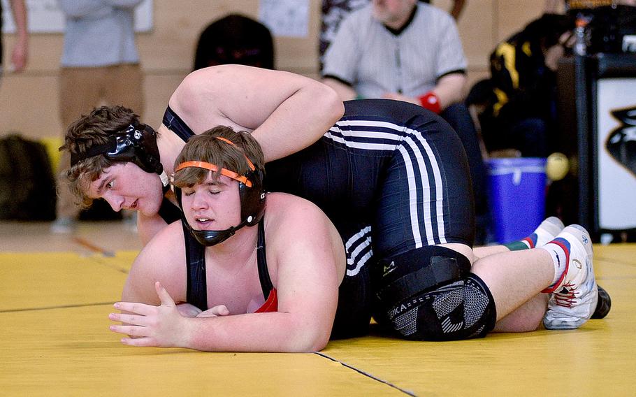 Spangdahlem’s Eli Hulet forces his brother, fellow Sentinel Hudson Hulet, against the mat in a 285-pound semifinal during a DODEA wrestling sectional meet on Feb. 3, 2024, at Stuttgart High School in Stuttgart, Germany.