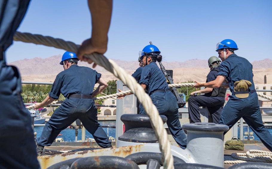 USS Carter Hall sailors haul on a mooring line during a port visit in Aqaba, Jordan. Carter Hall is part of the Norfolk-based Iwo Jima Amphibious Ready Group. 