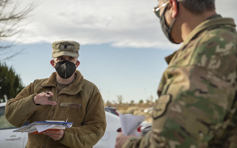 1st Lt. Eric Lawson, 412th Test Wing, monitors the COVID-19 vaccination line outside the Airmen and Family Readiness Center at Edwards Air Force Base, Calif., Jan. 22, 2021. Edwards Air Force Base will move from Health Protection Condition Alpha to Bravo beginning June 21, according to the base’s website and Facebook page.