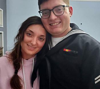 Petty Officer 3rd Class Nicholas Woods, a sailor assigned to the cruiser USS Leyte Gulf, seen here in a Facebook photo with his sister Kate, died Aug. 18, 2022, aboard the ship at sea, the Navy announced Aug. 20.