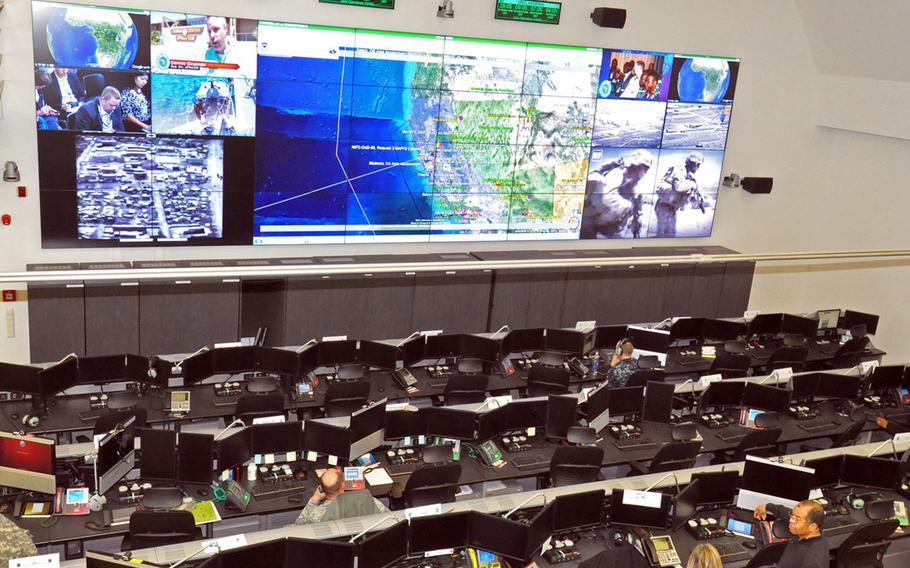 The joint operations center at U.S. Africa Command headquarters in Stuttgart, Germany. Modern command centers feature arrays of screens with live drone imagery, which is beamed to high-ranking leaders thousands of miles away.