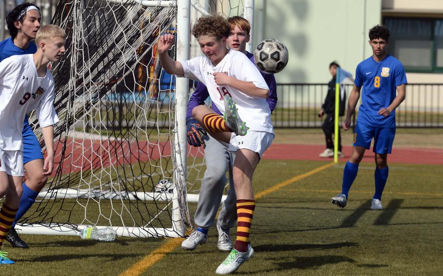 Matthew C. Perry's Liam DiMarsico-Birkland clears the ball agaiinst Yokota during Friday's Perry Cup boys soccer match. The Panthers won 2-1.